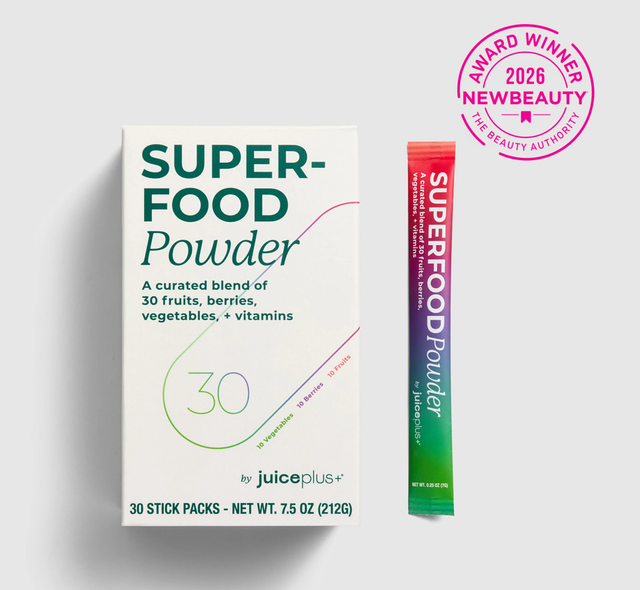 Superfood powder package with a stick pack on a white background, featuring Juice Plus+ branding.