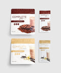 Four packages of Juice Plus+ Complete variety Shakes, two with chocolate flavor and two with vanilla flavor. Each package has an image of ingredients like chocolate chips and vanilla pods.