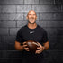 Image of Ambassador Ricky Proehl holding a football